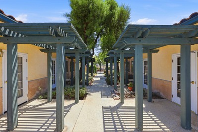 Pergola walkway between cottages